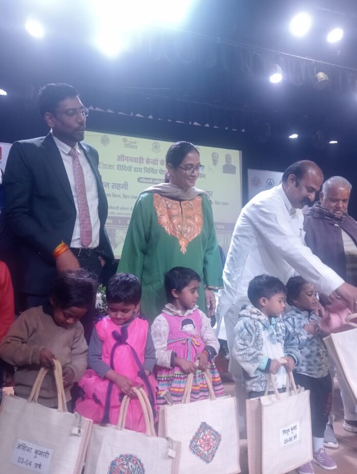 Children receiving uniforms FROM SHREE MADAN SAHANI during Anganwadi Uniform Distribution in Khajasarai